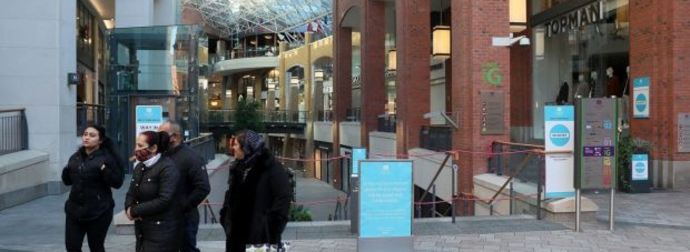 People walk past the closed Victoria Square Shopping centre in Belfast city centre as the Covid-19 lockdown in Northern Ireland continues. Photograph: Brian Lawless/PA Wire